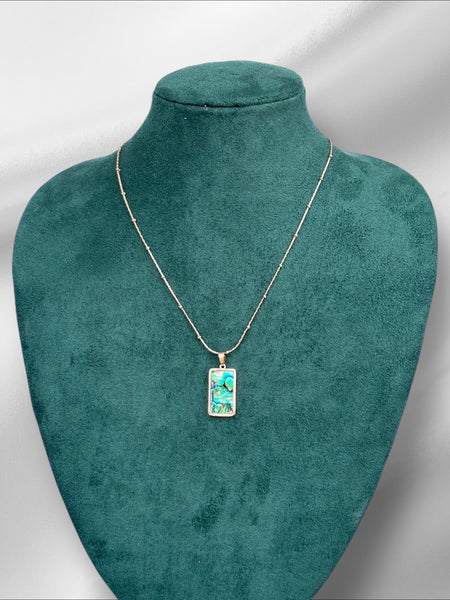 Beaded chain with abstract pendant