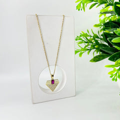 Studded triangle with red stone