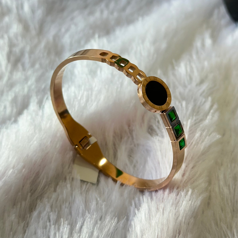 Gold Bracelet with green stones