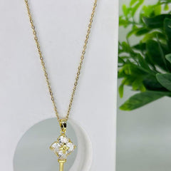 Gold Flower on a  Key Pendant Necklace