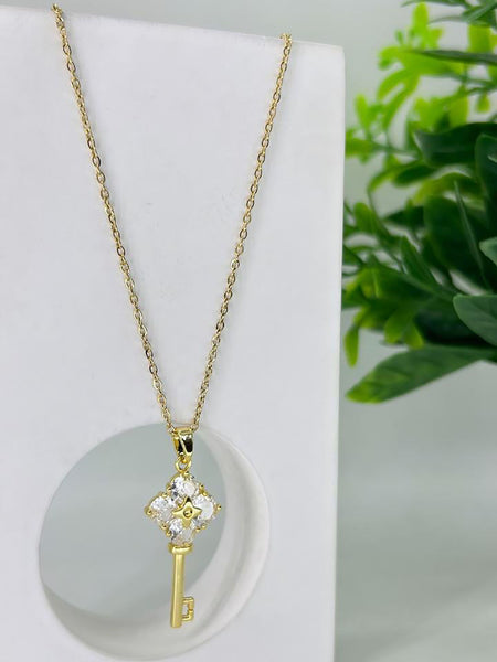 Gold Flower on a  Key Pendant Necklace